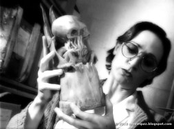 A scholar examines a curious idol (from the HPLHS's 'Call of Cthulhu' film)